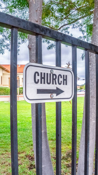 istock Vertical Church sign with arrow outdoors on a sunny day 1198302249