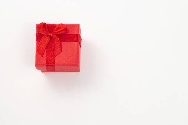 istock Red gift box with red ribbon bow isolated on white 1198302280