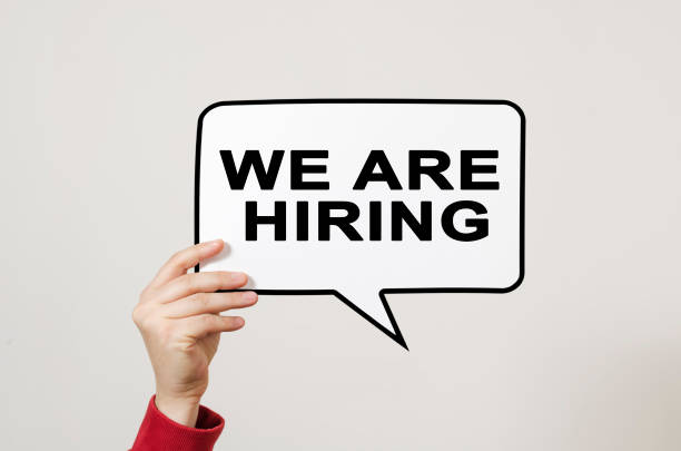 istock We are hiring text on speech balloon held by hand on light background. 1198302398
