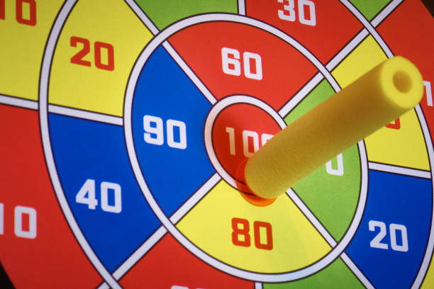 istock Velcro Darts, hitting the target with a bullet-dart with Velcro, close-up. 1198302418