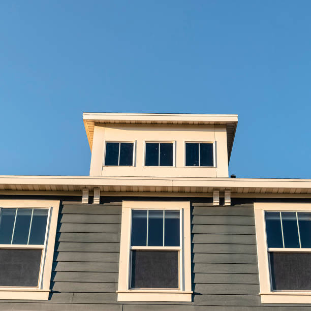 istock Square Grey wooden house with three upper windows 1198303156