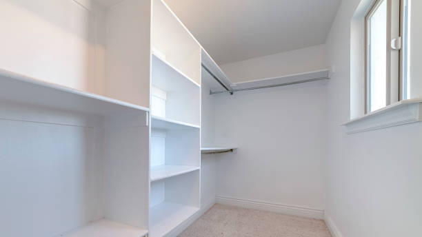 istock Panorama frame Empty white fitted interior of walk-in wardrobe 1198303219