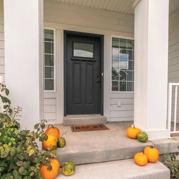 istock Square frame Halloween or autumn pumpkins on a house steps 1198304512