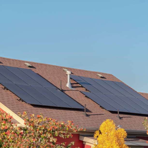 istock Square frame Photovoltaic solar panels on a house roof 1198305124