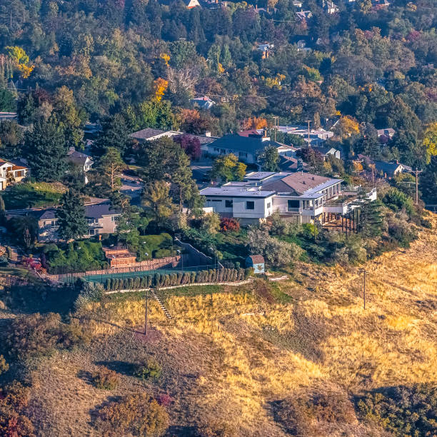 istock Square frame Suburban properties on a mountain slope on a sunny day 1198305849