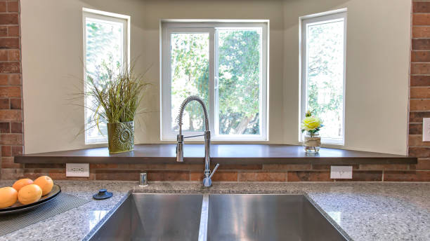 istock Panorama Kitchen sink close up with bay windows in the background 1198306064