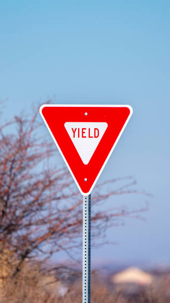 istock Vertical Red traffic Yield sign alongside a road 1198306235