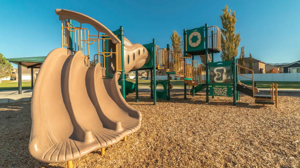 istock Panorama frame Unusual triple slide in a kids playground 1198307406