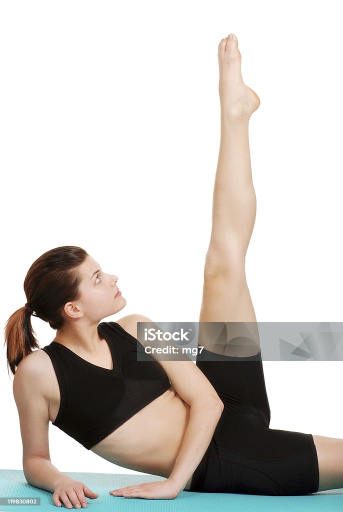 Молодая женщина, осуществляющие вид на ногу - Стоковые фото Aerobics роялти-фри
