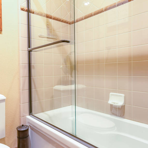 istock Square Master bath in luxury home with large glass shower bright and clean 1198308157