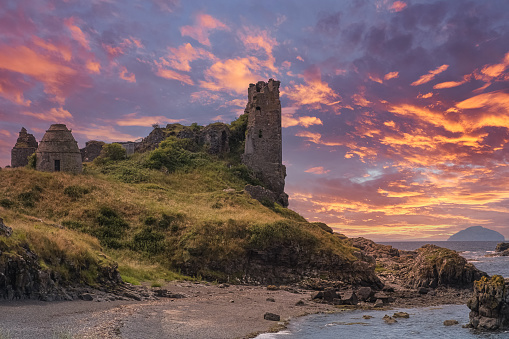 Dunure Rugged sea defences, its ancient castle ruins late in the afternoon as the sun was going down Scotland.