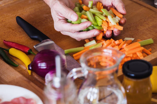 istock Food preparing, chopped celery sticks and carrot 1198309556