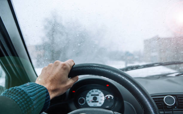 driving a car on a winter snowy day. Cold ride. stock photo