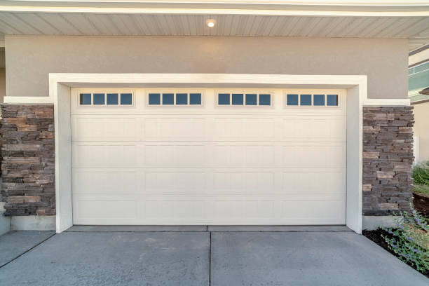 istock White automatic garage door for two cars 1198310638