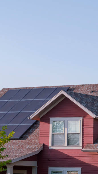 istock Vertical Array of photovoltaic solar panels on a roof 1198312060