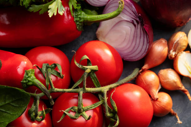 istock Mixed fresh colored vegetables and fresh herbs on a wooden background 1198312932