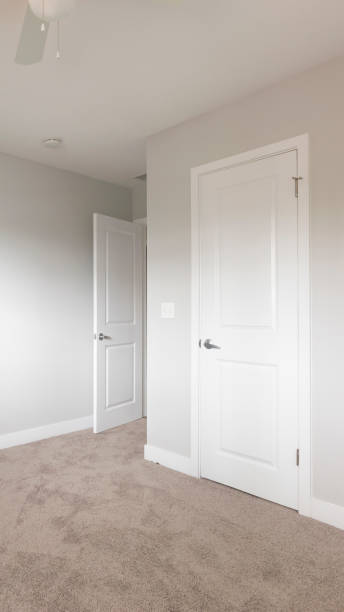 istock Vertical frame Empty bedroom with closed closet door 1198313877