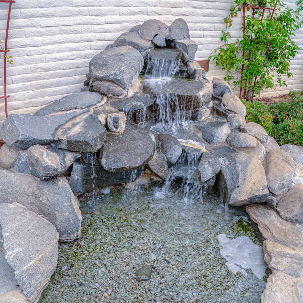 istock Square Cascade waterfall landscape decoration on a sunny day 1198314114