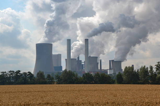 istock Factory chimneys emitting air pollutions 1198315139