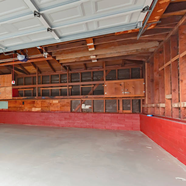 istock Square Garage doors open with a garage with wood support exposed 1198315361