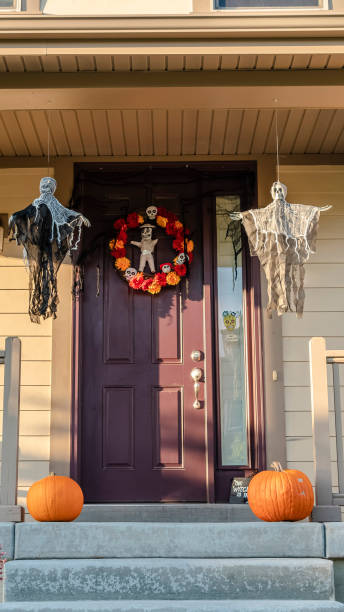 istock Vertical frame Front porch of a house decorated for Halloween 1198316310
