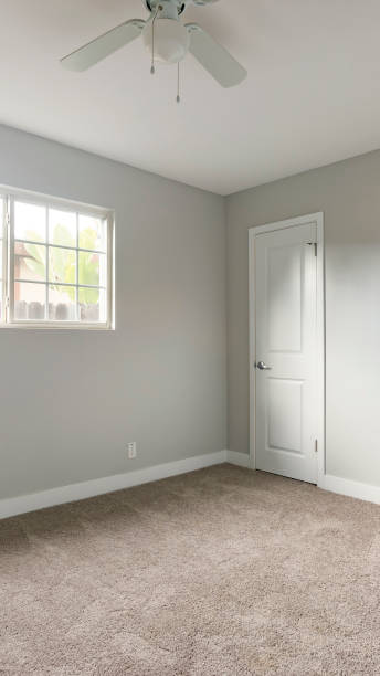 istock Vertical frame Empty bedroom with open door to hallway 1198316355