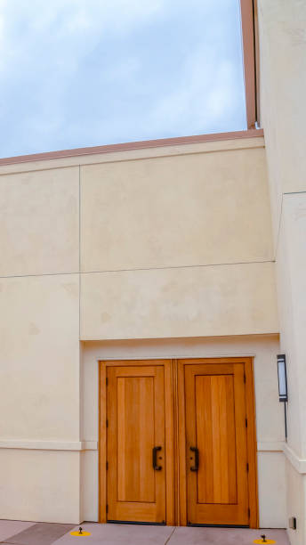 istock Vertical frame Double wooden side entrance doors on cloudy day 1198317520