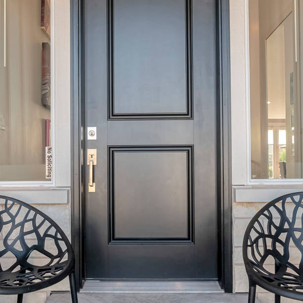 istock Square frame Two black chairs flanking an entrance door 1198317791