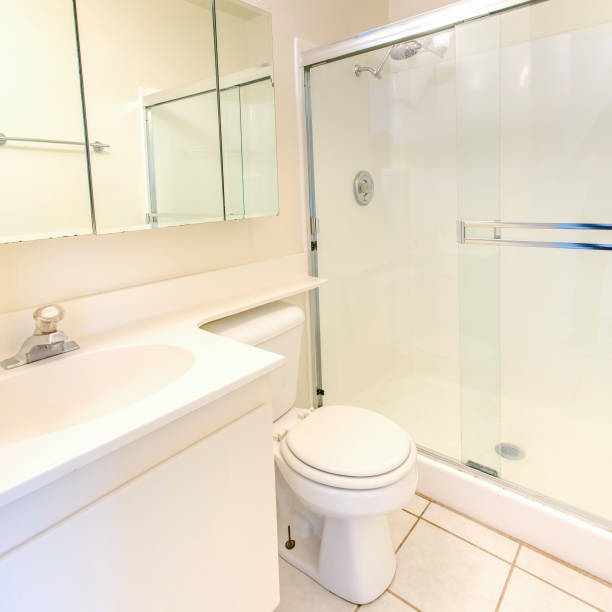 istock Square White bathroom with shower and glass door 1198317797