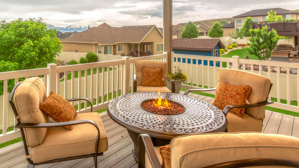 istock Pano frame Chairs around table with fire pit at a residential balcony framed with railings 1198318516