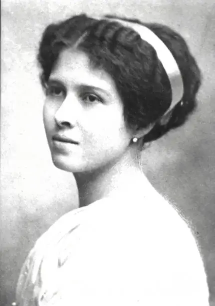 Photo of Old image (made in 1905) studio shot of a caucasian young woman looking away