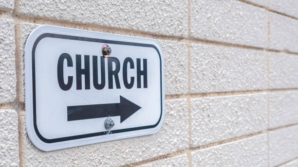 istock Panorama frame Church sign pointing to the right mounted on wall 1198319837