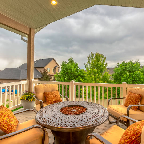 istock Square frame Balcony with chairs around table with fire pit against homes and mountain view 1198319848