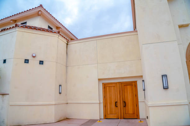 istock Double wooden side entrance doors on cloudy day 1198319894