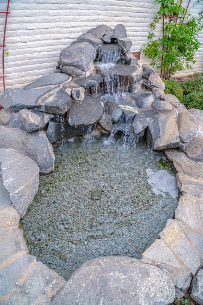 istock Cascade waterfall landscape decoration on a sunny day 1198320603
