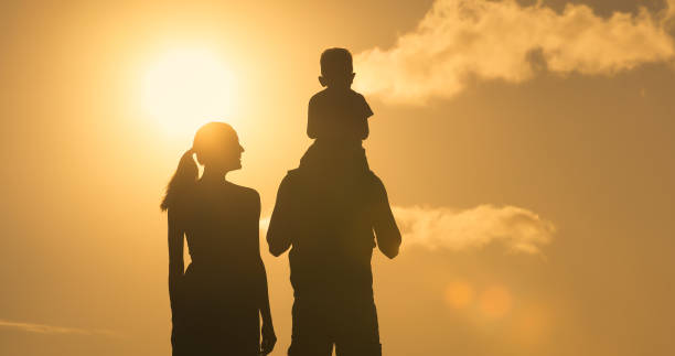 istock Happy family watching beautiful sunset. 1198320813