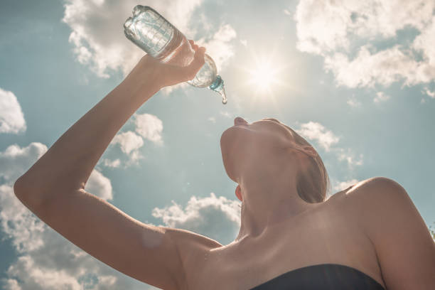 istock Woman drinking water 1198320881
