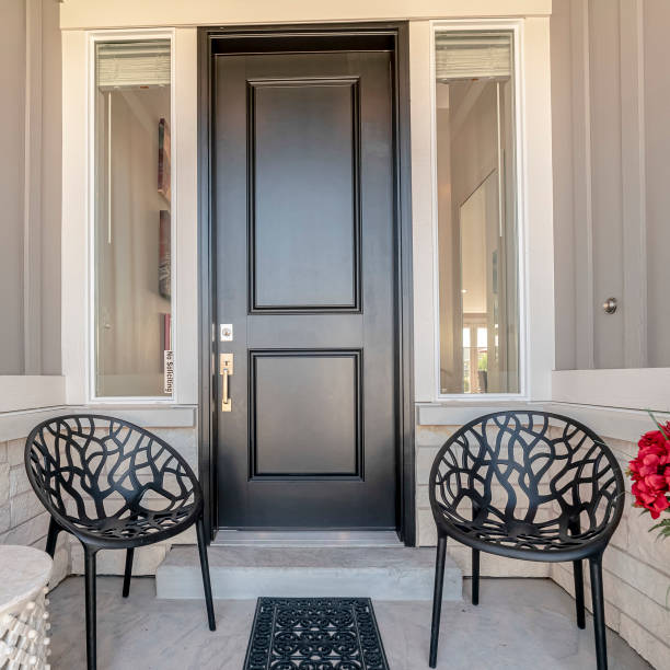 istock Square frame Two black chairs flanking an entrance door 1198321063