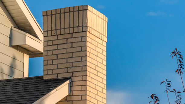 istock Panorama Feature brick chimney on a house exterior 1198321615