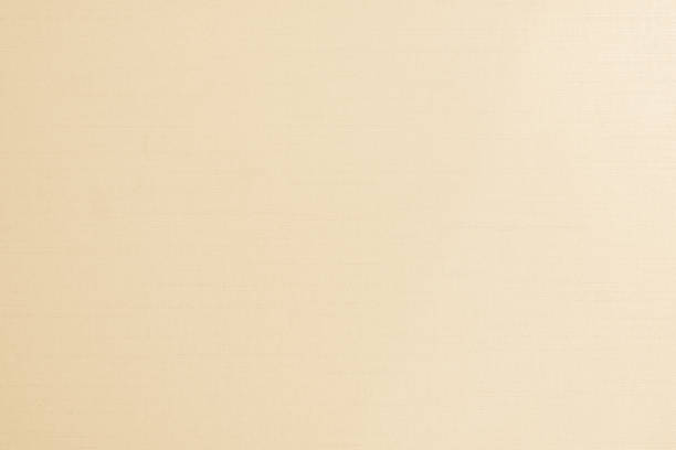 istock Cotton silk fabric wall paper texture pattern background in light pastel white yellow cream beige sepia tan brown color earth tone 1198321941