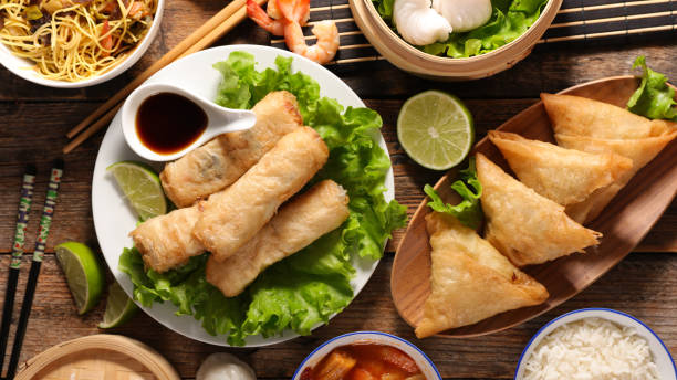 istock assorted of asian food, spring roll- samossa- dim sum- fried noodles 1198327662