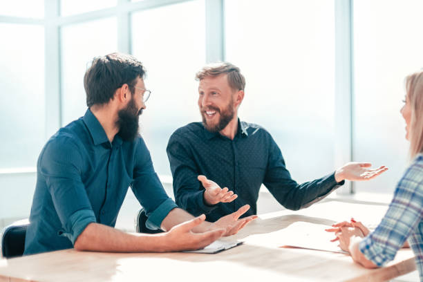 istock young woman sitting at interview in office. 1198328057