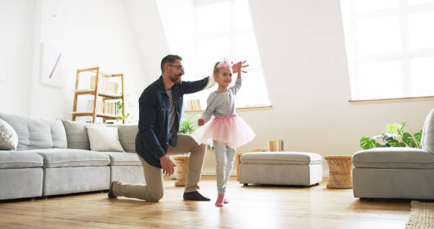 istock Dad loves dancing with his precious little princess 1198328177