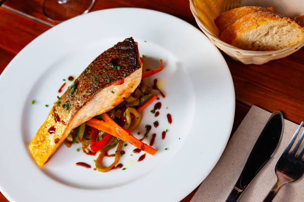 istock Grilled salmon steak with sauteed vegetables 1198328333