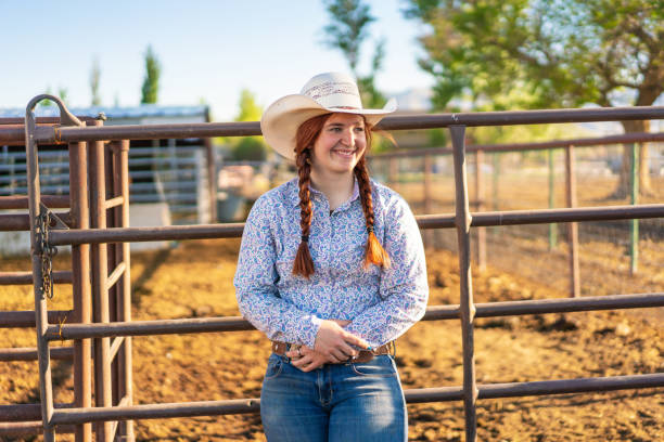 istock Cowgirl using her phone at a ranch 1198335154
