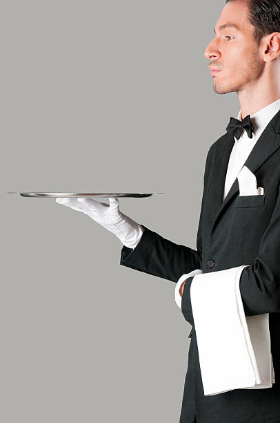 istock Proud waiter serving with tray 119833641