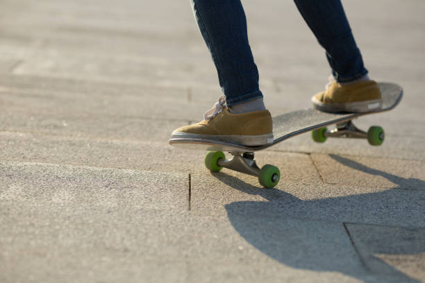 istock Skateboarder legs skateboarding at city 1198337976