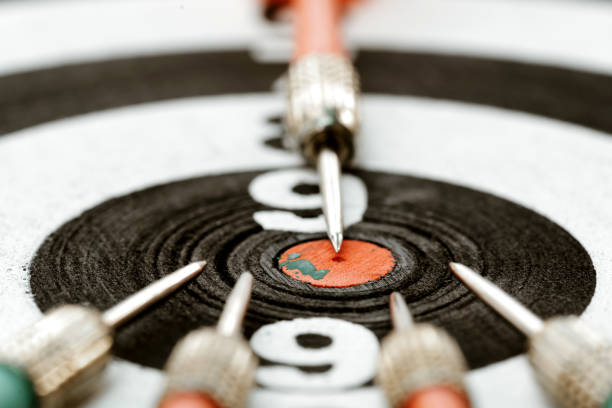 istock Close-up dart arrow point to target centre dartboard. business think different or teamwork concept. 1198339429
