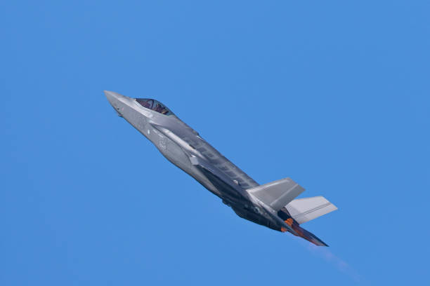 istock Combat aircraft in a climb with afterburner on 1198340232