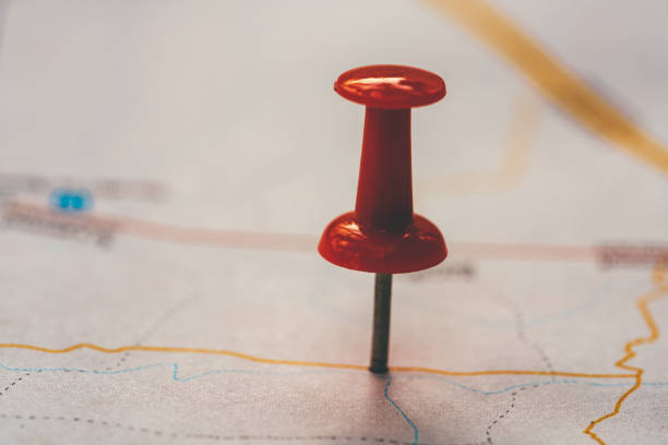 istock Closeup red pin putting destination with map background. Plan travelling and vacation with holiday concept. 1198340708
